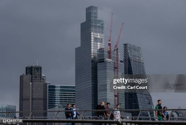 Office buildings in the City of London loom over the Millennium Bridge on September 23, 2022 in London, England. Earlier today Britain's Chancellor...