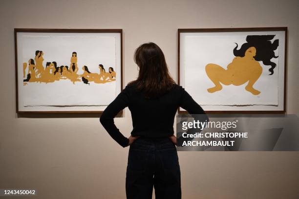Visitor looks at artworks by Afghan artist Kubra Khademi during a preview of the exhibition 'Habibi - Les revolutions de l'amour' at the Institut du...