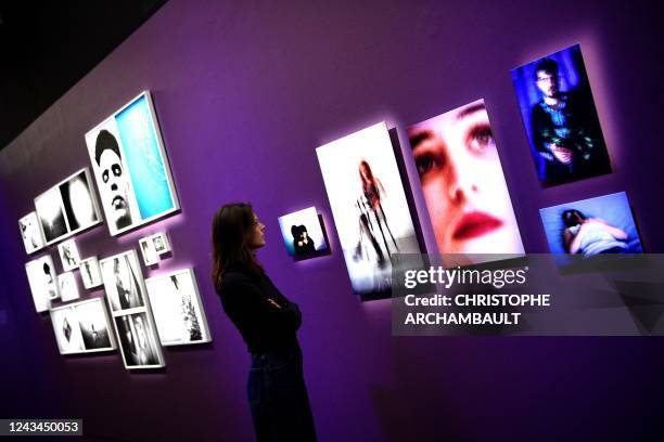 Visitor looks at artworks by artists Salih Basheer and Fadi Elias during a preview of the exhibition 'Habibi - Les revolutions de l'amour' at the...