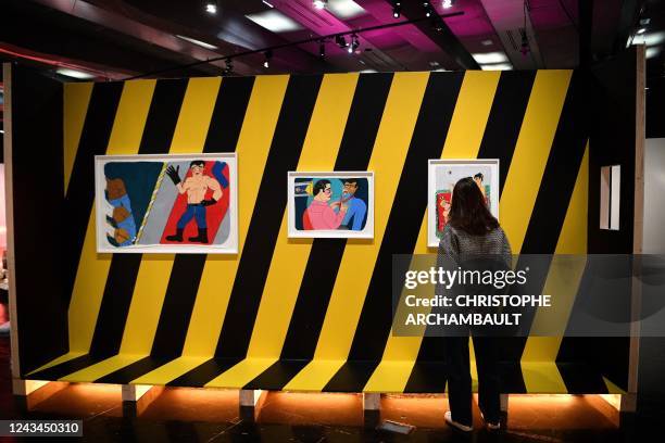 Visitor looks at artworks by artist Soufiane Ababri during a preview of the exhibition 'Habibi - Les revolutions de l'amour' at the Institut du Monde...
