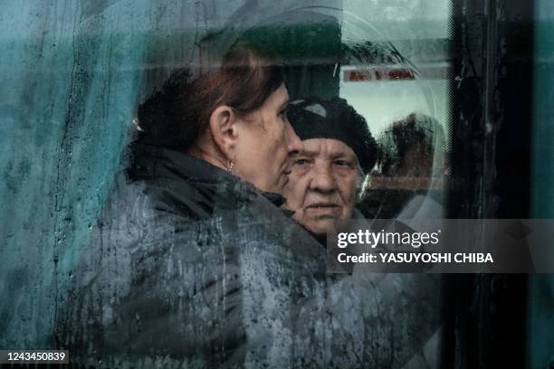 Mariya and Tatyana from a frontline city of Kupiansk wait in a bus to evacuate in Shevchenkove, Kharkiv region, on September 23, 2022. - Kyiv said...
