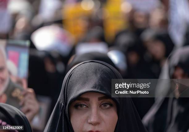 An Iranian woman who is a supporter of Irans Supreme Leader Ayatollah Ali Khamenei takes part a pro-government rally against Irans anti government...
