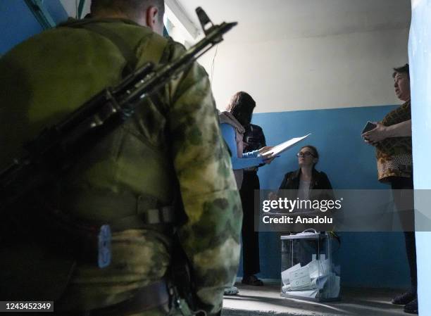 Residents cast their votes in controversial referendums in Donetsk Oblast, Ukraine on September 23, 2022. Voting will run from Friday to Tuesday in...