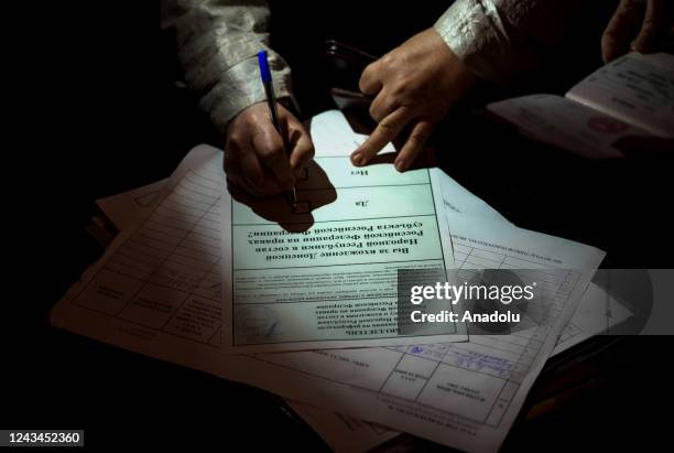 Residents cast their votes in controversial referendums in Donetsk Oblast, Ukraine on September 23, 2022. Voting will run from Friday to Tuesday in...