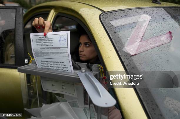 Residents cast their votes in controversial referendums in Donetsk Oblast, Ukraine on September 23, 2022. Voting will run from Friday to Tuesday in...