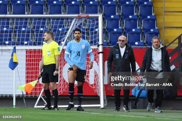 Ronald Araujo of Uruguay goes off injured during the International Friendly match between Iran and Uruguay at NV Arena on September 23, 2022 in St....