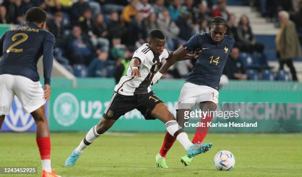 Youssoufa Moukoko of Germany challenges Castello Lukeba of France during the International Friendly between Germany U21 and France U21 at MDCC Arena...