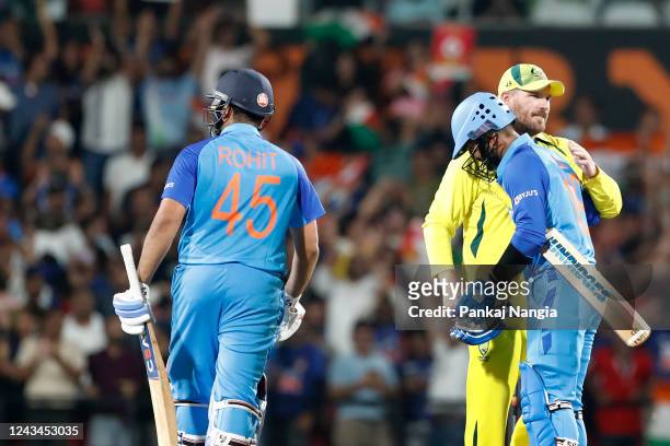 Dinesh Karthik and Rohit Sharma of India celebrate the victory during game two of the T20 International series between India and Australia at...