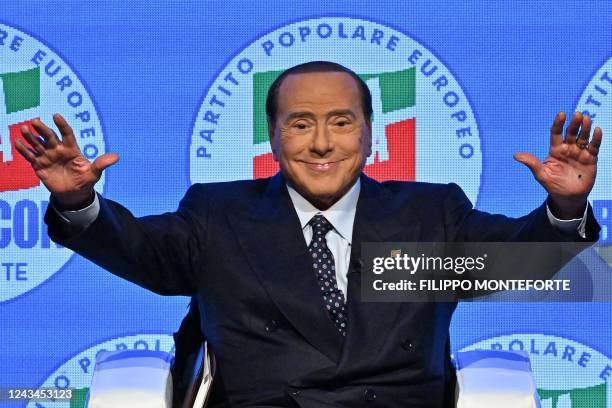 Leader of Italian right-wing party "Forza Italia", Silvio Berlusconi acknowledges applause on stage on September 23, 2022 at the Manzoni theater in...