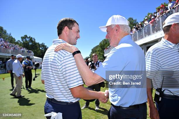 Former President of the United States Bill Clinton greets Patrick Cantlay of the United States Team on the first tee during the second round of...