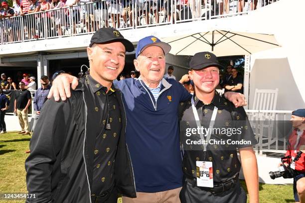 International Team Captain Trevor Immelman of South Africa, L-R, President George W. Bush and Jacob Immelman pose for a photo during the first round...