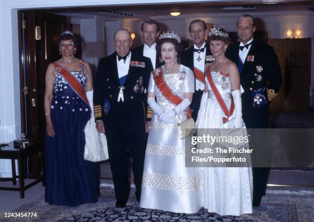 Princess Astrid, King Olav V , Queen Elizabeth II , Crown Princess Sonja, Johan Ferner, Prince Philip and Crown Prince Harald at a banquet on board...