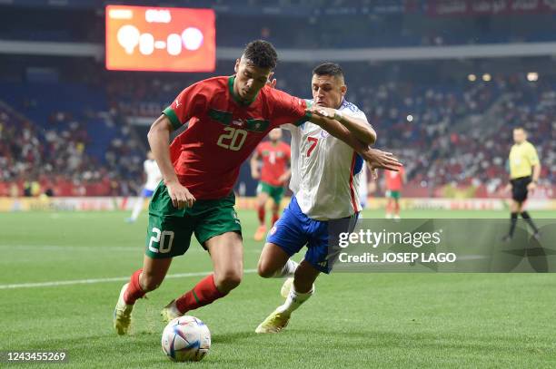 Morocco's defender Achraf Dari vies with Chiles' forward Alexis Sanchez during the international friendly football match between Chile and Morocco at...