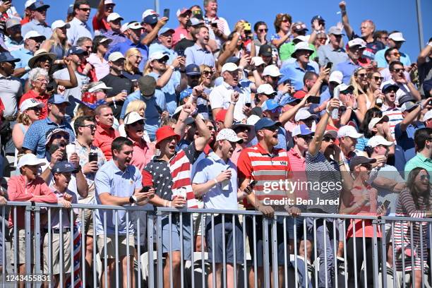 Fans are seen cheering on the first tee during the second round of Presidents Cup at Quail Hollow September 23 in Charlotte, North Carolina.