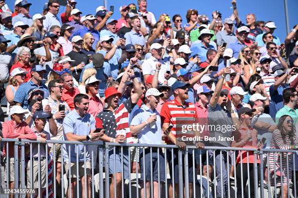 Fans are seen cheering on the first tee during the second round of Presidents Cup at Quail Hollow September 23 in Charlotte, North Carolina.