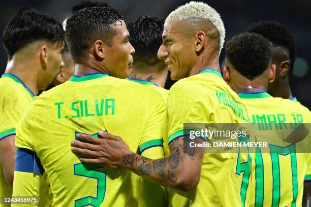 Brazil's forward Richarlison talks with Brazil's defender Thiago Silva during the friendly football match between Brazil and Ghana at the Oceane...