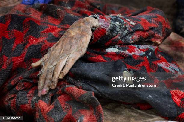 Body is exhumed from an unidentified makeshift grave at the Pishanske cemetery on September 23, 2022 in Izium, Ukraine. A total of 447 bodies was...