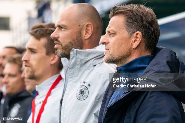 Headcoach Christian Woerns and staff members of Germany U18 are pictured during the national anthem prior to the U18-Nations-Tournament match between...
