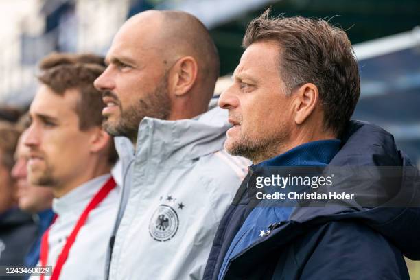 Headcoach Christian Woerns and staff members of Germany U18 are pictured during the national anthem prior to the U18-Nations-Tournament match between...