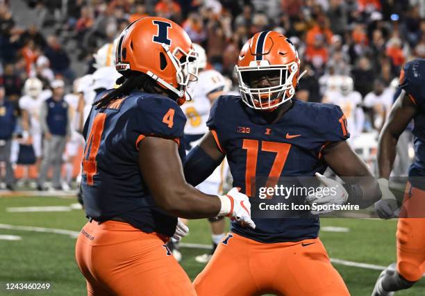 Illinois defensive end Jer'Zhan Newton and Illinois outside linebacker Gabe Jacas celebrate after a quarterback sack during a college football game...