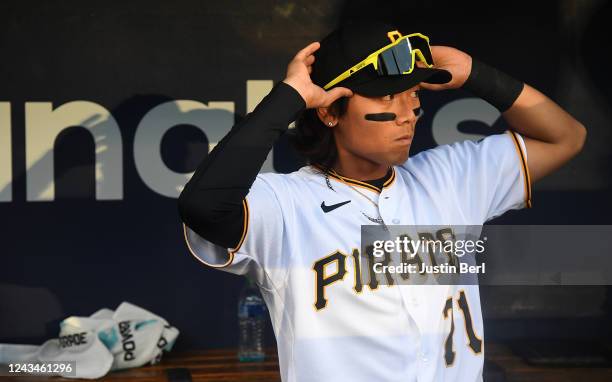 Ji-hwan Bae of the Pittsburgh Pirates looks on from the dugout before making his Major League debut during the game against the Chicago Cubs at PNC...