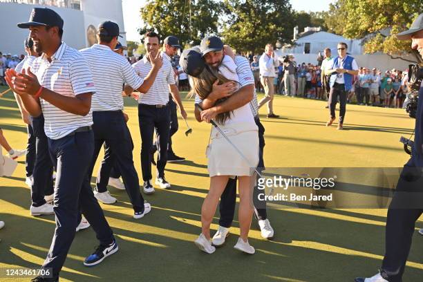 Max Homa of the United States Team reacts to a putt with his wife Lacey Homa during the second round Four-Ball matches of Presidents Cup at Quail...