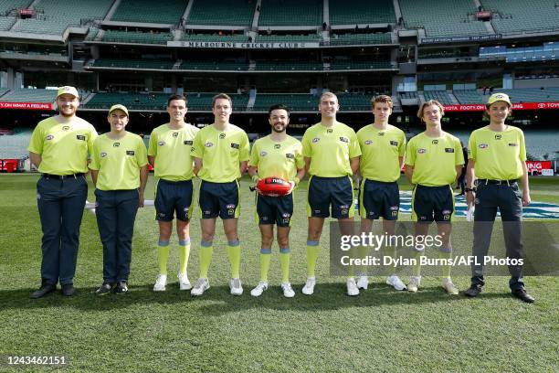 The umpires pose for a photo before the 2022 AFL Futures match between Team Houli and Team Murphy at the Melbourne Cricket Ground on September 24,...