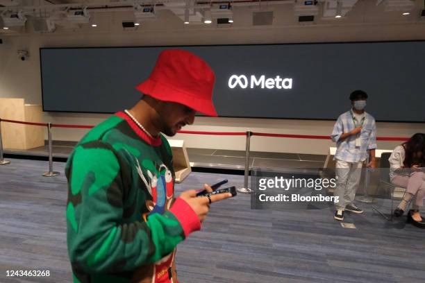 Man looks at digital devices at a pop-up studio for collaborating creators and artists inside Meta Platforms Inc. India headquarters in Gurugram,...