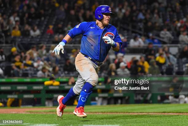 Esteban Quiroz of the Chicago Cubs rounds the bases after hitting an RBI single in the eighth inning during the game against the Pittsburgh Pirates...