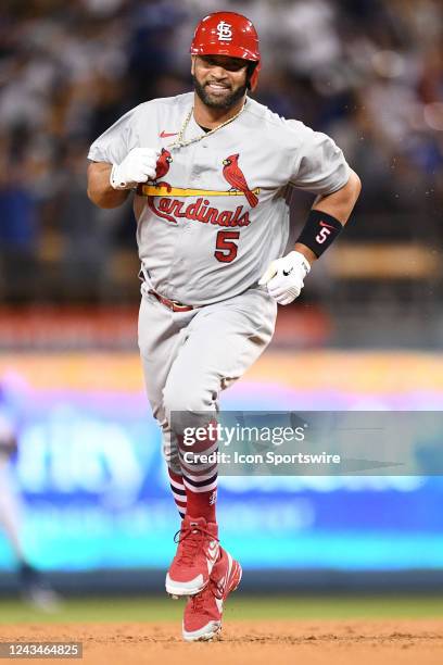 St. Louis Cardinals designated hitter Albert Pujols circles the bases after his career home run number 700 as a three run home run in the 4th inning...