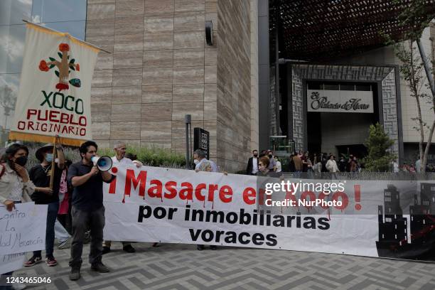 Residents of the town of Xoco in Coyoacán, Mexico City, demonstrate during the inauguration of the Mitikah shopping centre, which includes two...