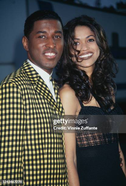 American singer-songwriter Babyface and his wife, American television producer Tracey Edmonds attend the 21st Annual American Music Awards, held at...