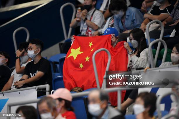 Chinese national flag is seen at the women's singles semi-final match between Zheng Qinwen of China and Russia's Veronika Kudermetova at the Pan...