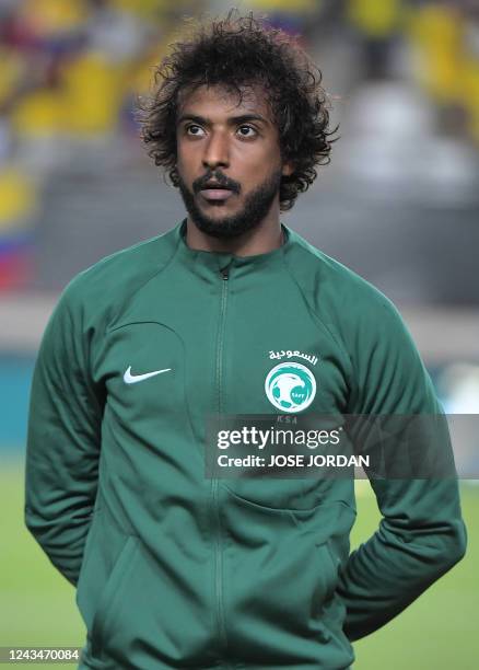 Saudi Arabia's defender Yasser al-Shahrani lines up for the national anthems prior the international friendly football match between Saudi Arabia and...