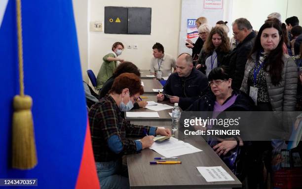 Refugees from Ukraine regions held by Russia arrive to vote for a referendum at a polling station in Rostov-on-Don on September 24, 2022. - The...