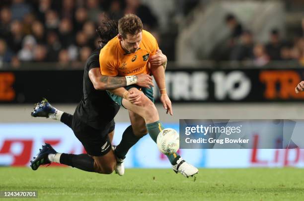 Rieko Ioane of the All Blacks tackles Bernard Foley of the Wallabies during The Rugby Championship and Bledisloe Cup match between the New Zealand...