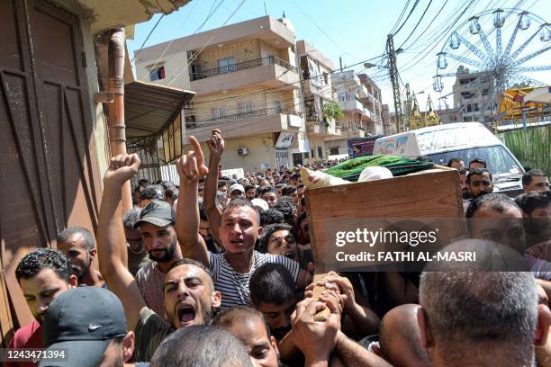 Mourners chant slogans as they march with the body of one of the victims who drowned in the shipwreck of a migrant boat that sank off the Syrian...