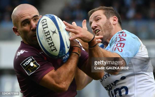 Bordeaux's French scum-half Maxime Lucu vies with Bayonne's French fly-half Camille Lopez during the French Top14 rugby union match between Bayonne...