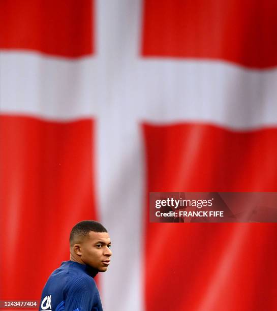 France's forward Kylian Mbappe looks on during a training session at the Telia Parken stadium in Copenhagen, on September 24, 2022 on the eve of he...