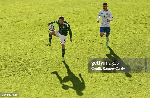 Belfast , United Kingdom - 24 September 2022; Steven Davis of Northern Ireland in action against Milot Rashica of Kosovo during the UEFA Nations...