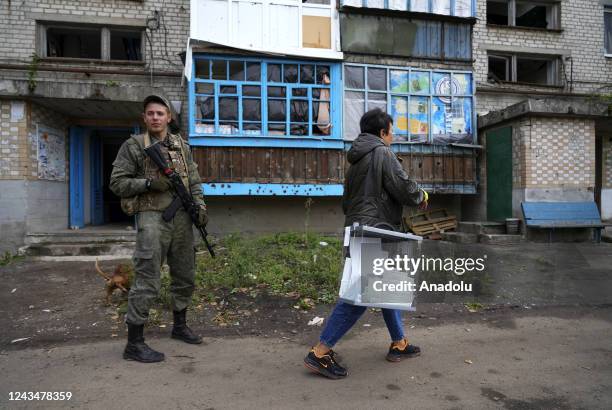 People cast their votes in controversial referendums at a hospital in Donetsk Oblast, Ukraine on September 23, 2022. Voting will run from Friday to...