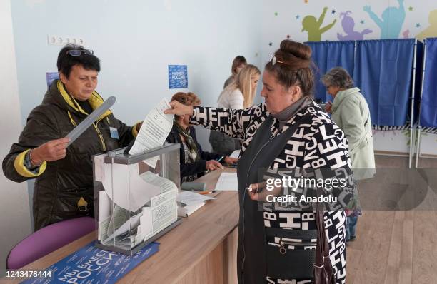 People cast their votes in controversial referendums at a hospital in Donetsk Oblast, Ukraine on September 24, 2022. Voting will run from Friday to...