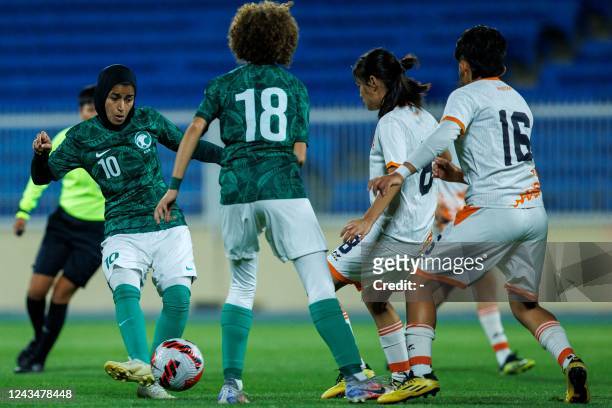 Saudi Arabia's Sara Mohammed passes the ball during a friendly football match between Saudi Arabia and Bhutan at Prince Sultan bin Abdulaziz stadium...