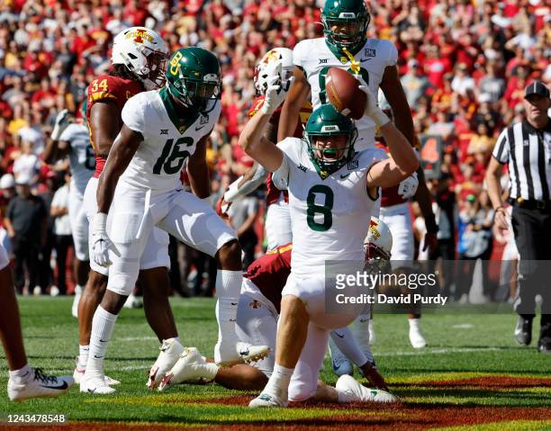 Linebacker O'Rien Vance of the Iowa State Cyclones watches on as Tight end Ben Sims of the Baylor Bears celebrates with teammates wide receiver Hal...
