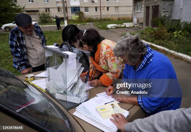 People cast their votes in controversial referendums in Donetsk Oblast, Ukraine on September 24, 2022. Voting will run from Friday to Tuesday in...