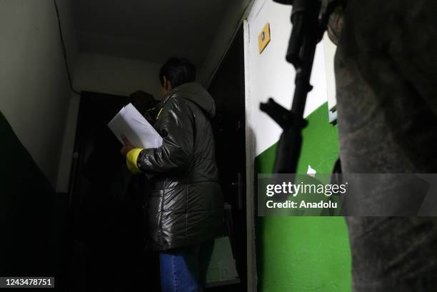 People cast their votes in controversial referendums at a hospital in Donetsk Oblast, Ukraine on September 24, 2022. Voting will run from Friday to...