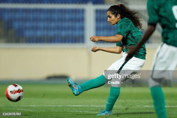 Saudi Arabia's Bayan Sadagah takes a shot during a friendly football match between Saudi Arabia and Bhutan at Prince Sultan bin Abdulaziz stadium in...