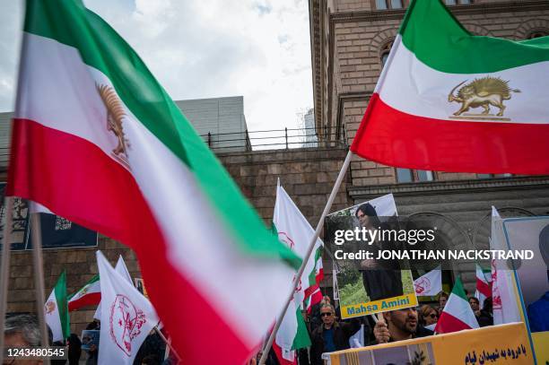 People protest outside the Swedish Parliament in Stockholm, Sweden, on September 24 following the death of an Iranian woman after her arrest by the...