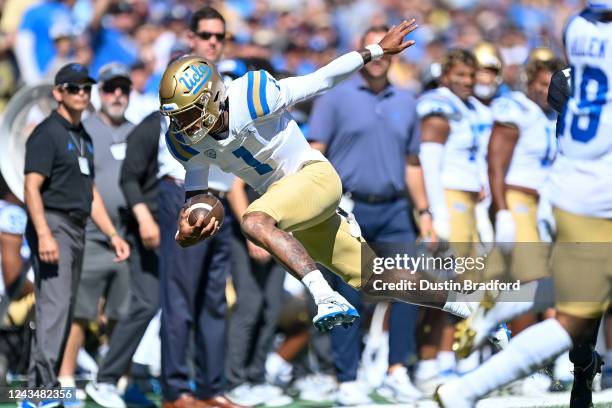 Quarterback Dorian Thompson-Robinson of the UCLA Bruins carries the ball against the Colorado Buffaloes in the first quarter of a game at Folsom...