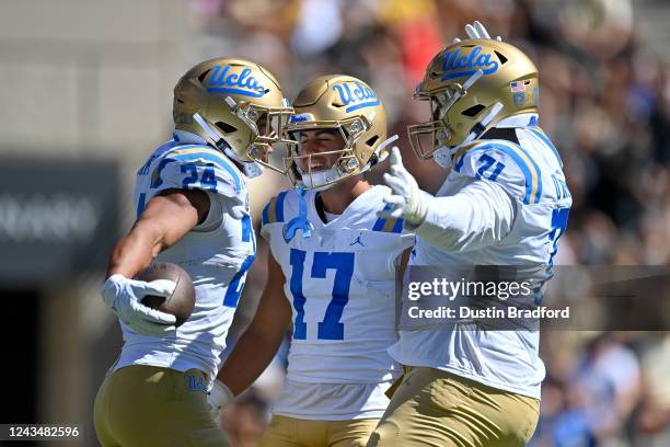 Running back Zach Charbonnet of the UCLA Bruins celebrates with wide receiver Logan Loya after a second quarter touchdown against the Colorado...